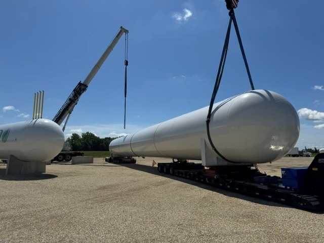 Bullet tank rigged in crane slings, ready to set